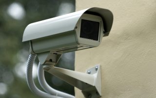 Picture of security camera on corner of building